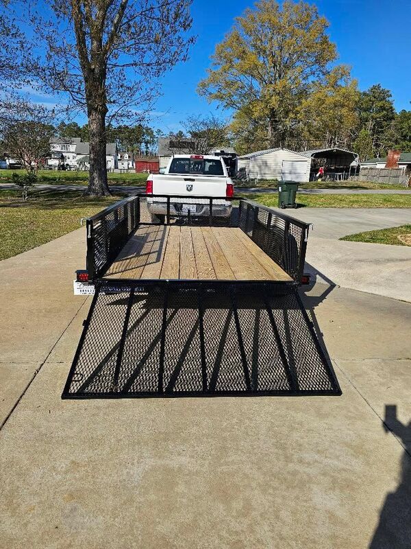 Utility trailer with ramp gate