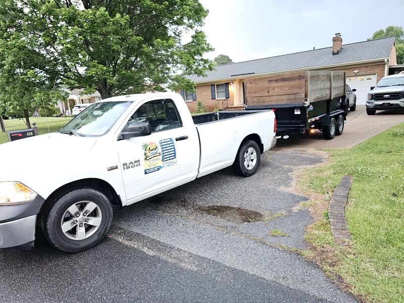 Thomas Enterprises truck delivering a dump trailer